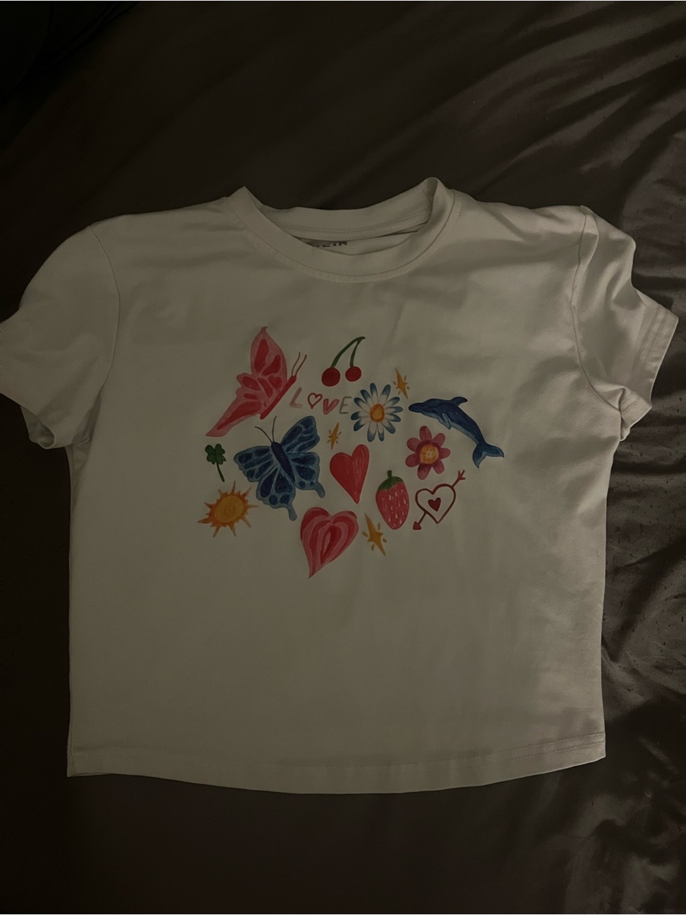 White Graphic Tee with Colorful Nature Motifs